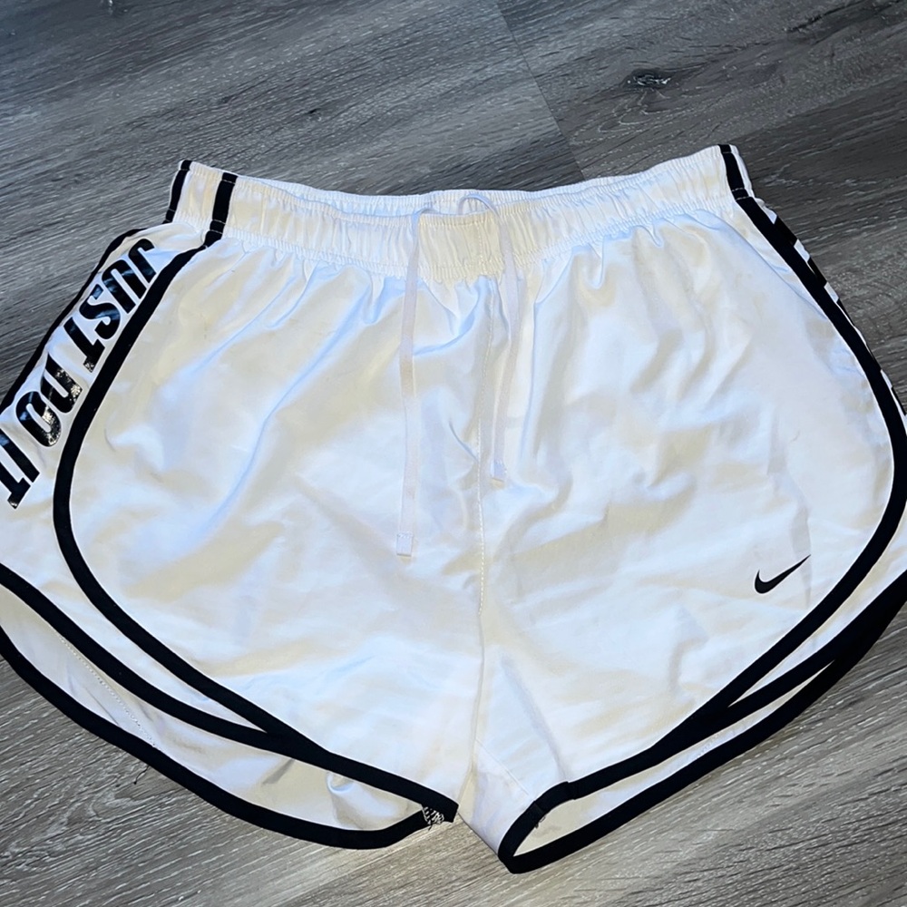 White Nike running shorts